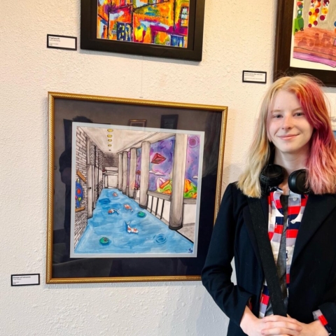 Framed "Illusion of Intrusion" at Rum River Art Center - 2023, Tess Peters on right of image.